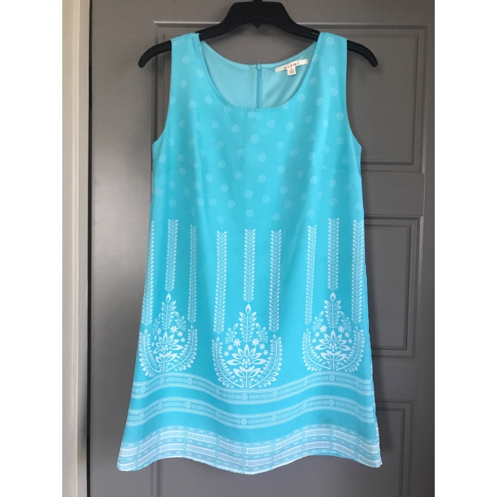 Teal dress with white flower pattern